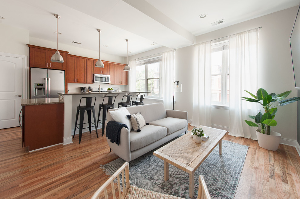 Living room - small scandinavian open concept medium tone wood floor living room idea in Phoenix with white walls and a wall-mounted tv