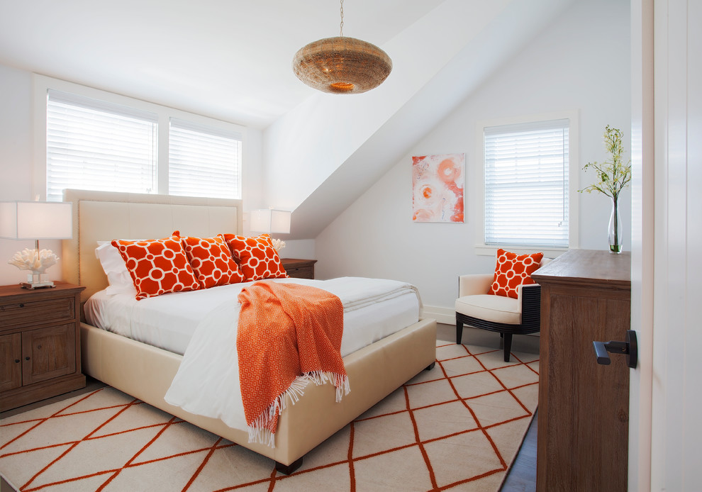This is an example of a beach style bedroom in Boston with white walls, dark hardwood floors and no fireplace.