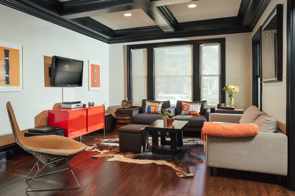 Photo of a mid-sized industrial formal enclosed living room in Detroit with a wall-mounted tv and white walls.