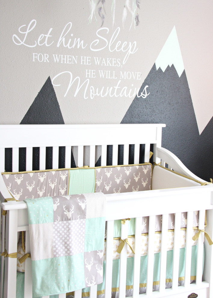 Design ideas for a large transitional nursery for boys in Austin with grey walls and light hardwood floors.