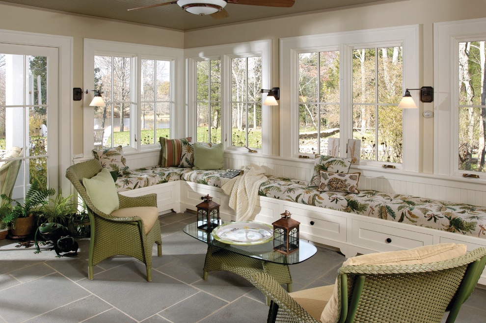 Photo of a mid-sized traditional sunroom in New York with slate floors, a standard ceiling and grey floor.