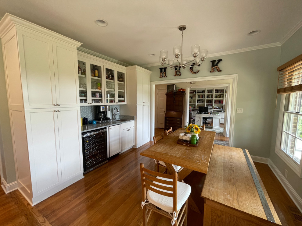 Inspiration for a large transitional light wood floor and brown floor eat-in kitchen remodel with an undermount sink, shaker cabinets, white cabinets, quartzite countertops, green backsplash, marble backsplash, stainless steel appliances, an island and gray countertops
