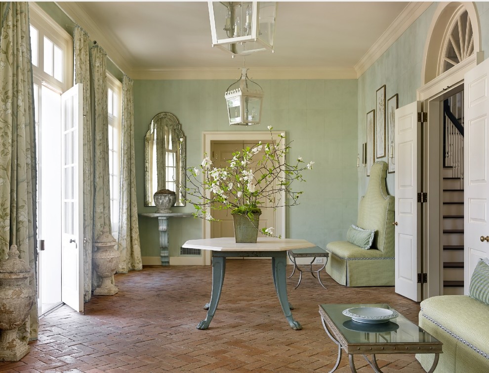 Design ideas for a traditional entryway in Atlanta with brick floors and green walls.