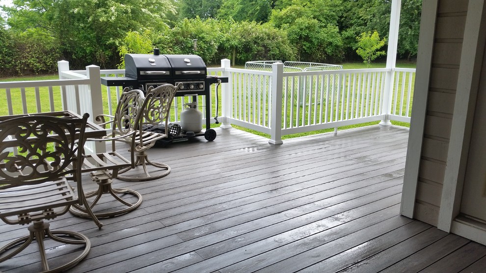 Inspiration for a large deck remodel with a roof extension