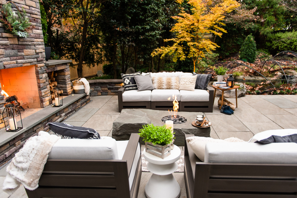 Mid-sized modern backyard patio in Richmond with with fireplace and natural stone pavers.