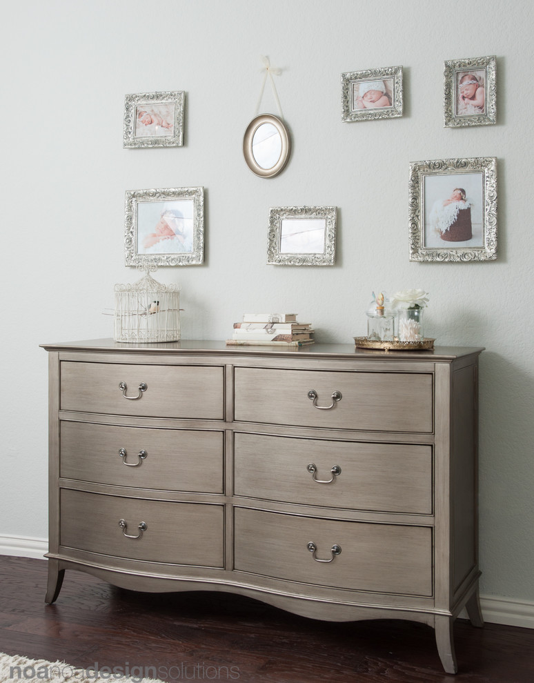 Inspiration for a mid-sized traditional nursery for girls in Austin with dark hardwood floors.