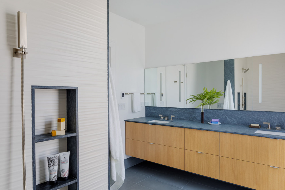 Mid-sized contemporary master bathroom in Boston with flat-panel cabinets, light wood cabinets, an alcove shower, a one-piece toilet, white walls, porcelain floors, an undermount sink, engineered quartz benchtops, grey floor, an open shower and blue benchtops.