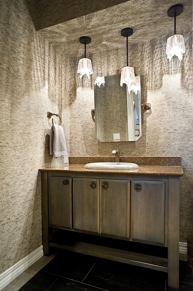 Inspiration for a mid-sized transitional powder room remodel with a two-piece toilet, a drop-in sink and granite countertops