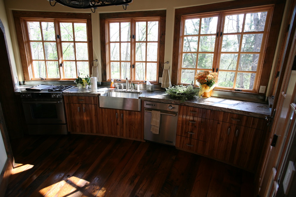 Open concept kitchen - large rustic l-shaped medium tone wood floor and brown floor open concept kitchen idea with an undermount sink, granite countertops, brown backsplash, stone tile backsplash, stainless steel appliances, an island and medium tone wood cabinets