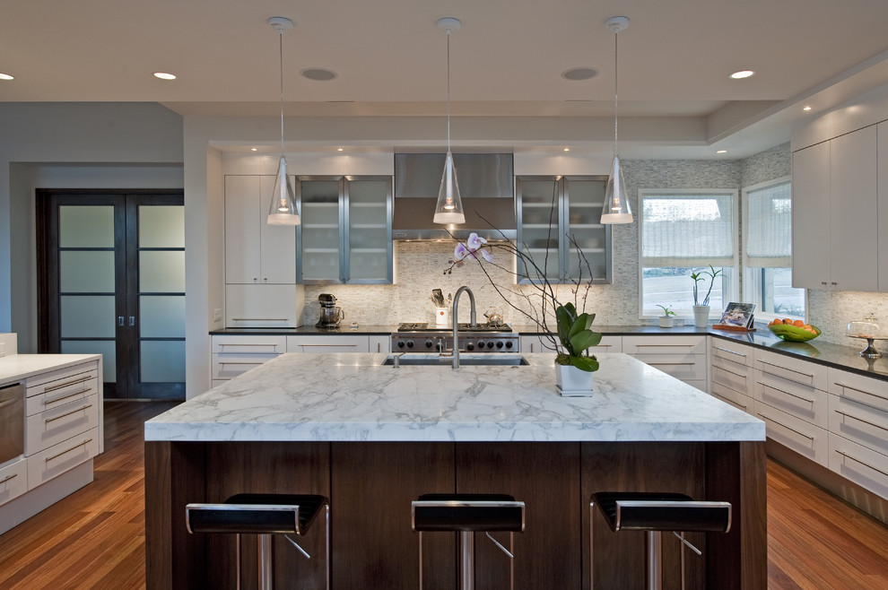 Photo of a contemporary kitchen in Austin with an undermount sink, flat-panel cabinets, white cabinets and white splashback.