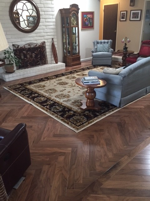 Inspiration for a traditional living room in Sacramento with dark hardwood floors and brown floor.
