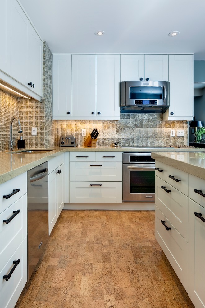Inspiration for a small contemporary l-shaped separate kitchen in Toronto with an undermount sink, shaker cabinets, white cabinets, quartz benchtops, brown splashback, ceramic splashback, stainless steel appliances, cork floors and with island.