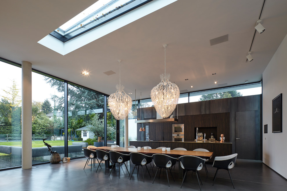 Photo of a large contemporary open plan dining in Cologne with white walls, vinyl floors, no fireplace and grey floor.