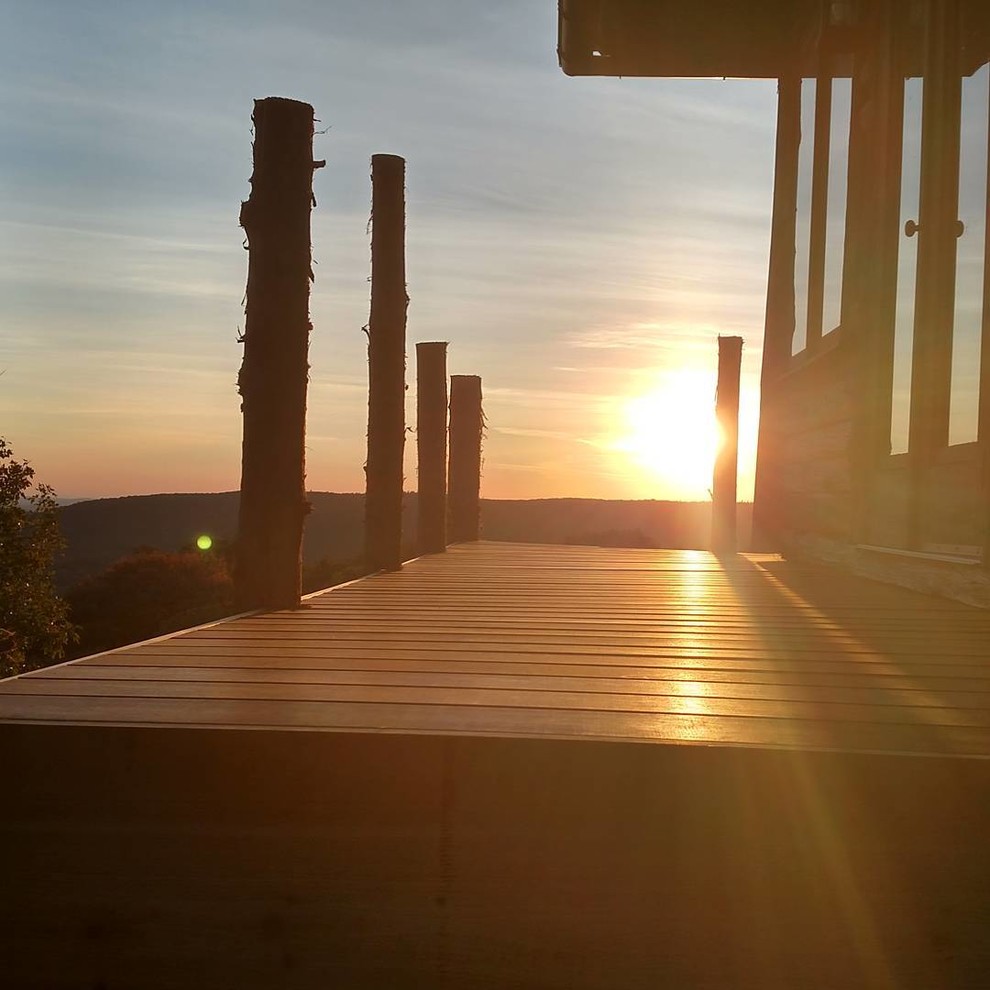 Mountain style backyard deck photo in New York with no cover
