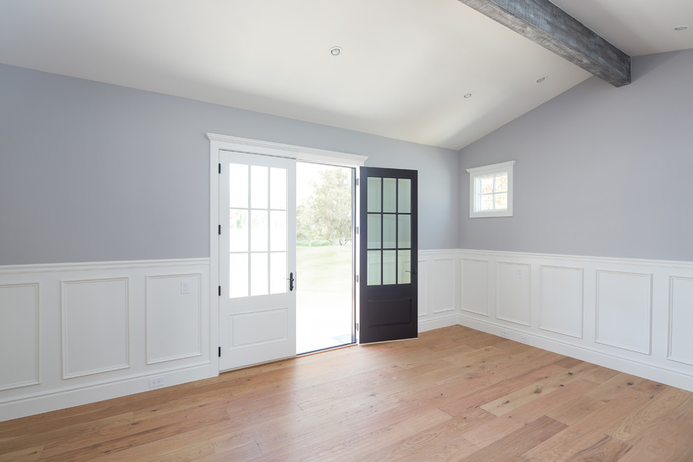 Example of a large transitional master light wood floor home design design in Phoenix with blue walls and no fireplace
