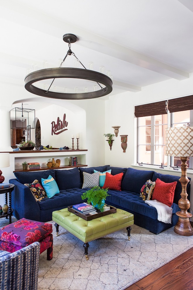 Transitional dark wood floor and brown floor living room photo in Los Angeles with white walls