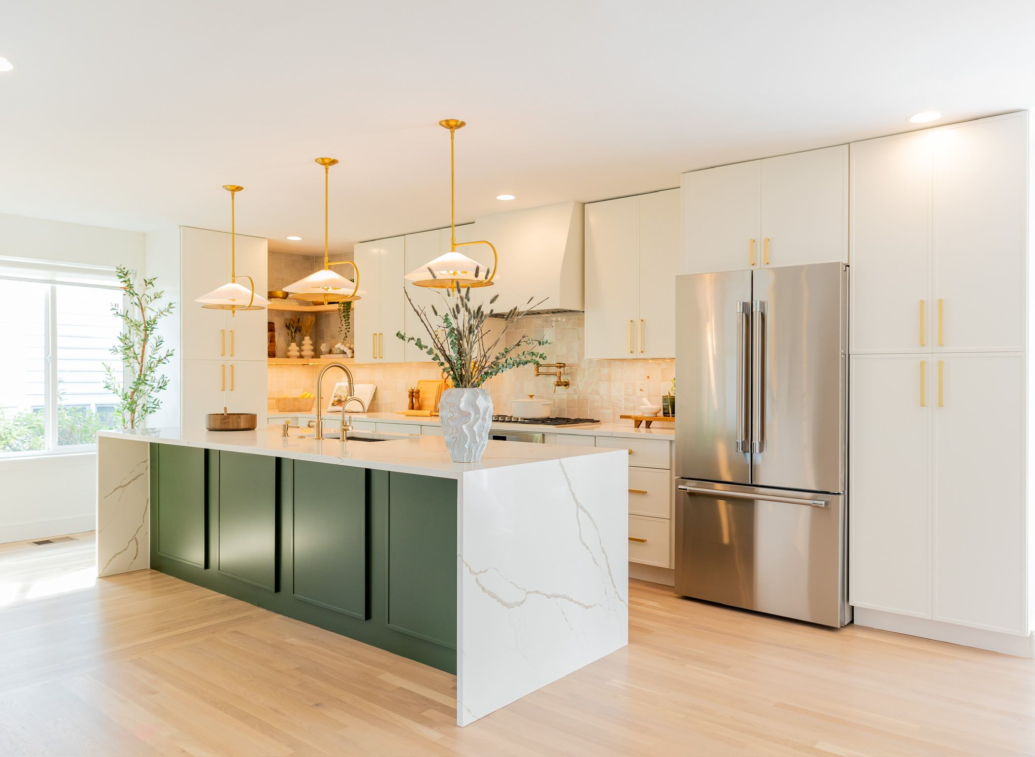 There are so many beautiful details to appreciate in this transitional/contemporary kitchen. We knocked down 3 walls to create a fully open-concept kitchen with the living and dining room. This really