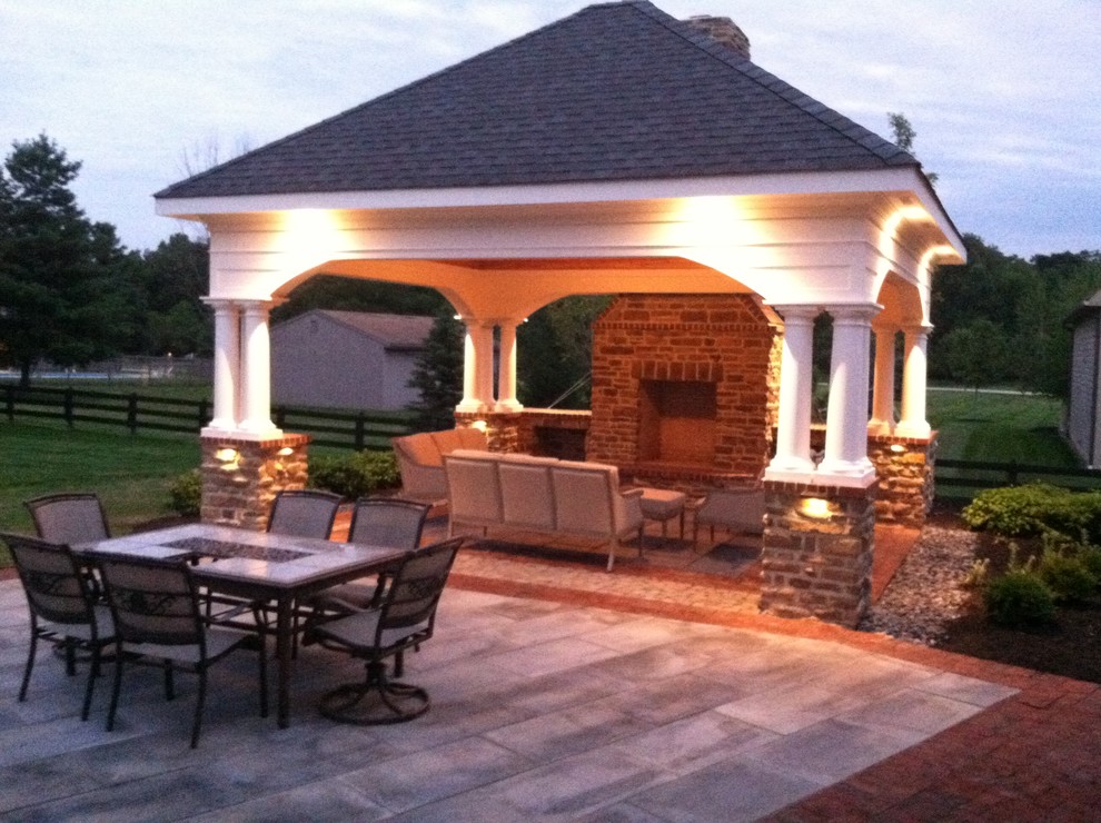 Photo of a large country backyard patio in Columbus with a fire feature, concrete pavers and a gazebo/cabana.