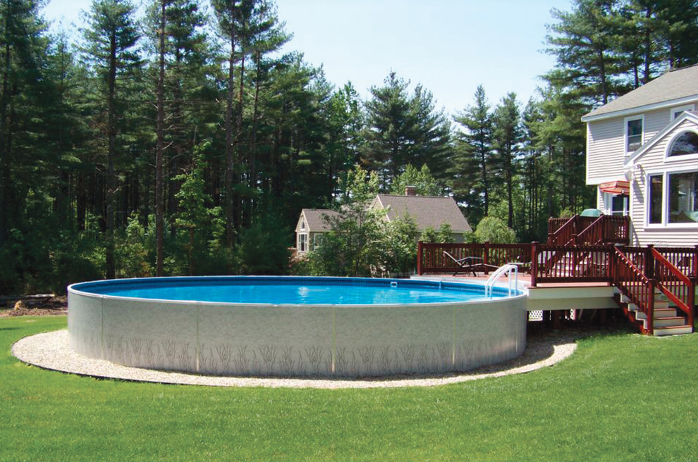Design ideas for a mid-sized contemporary backyard round aboveground pool in Cleveland with gravel.
