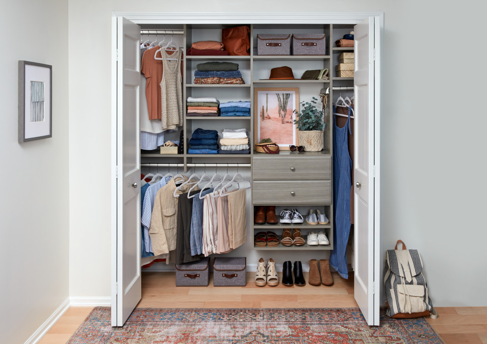 Design ideas for a mid-sized transitional storage and wardrobe in Grand Rapids.