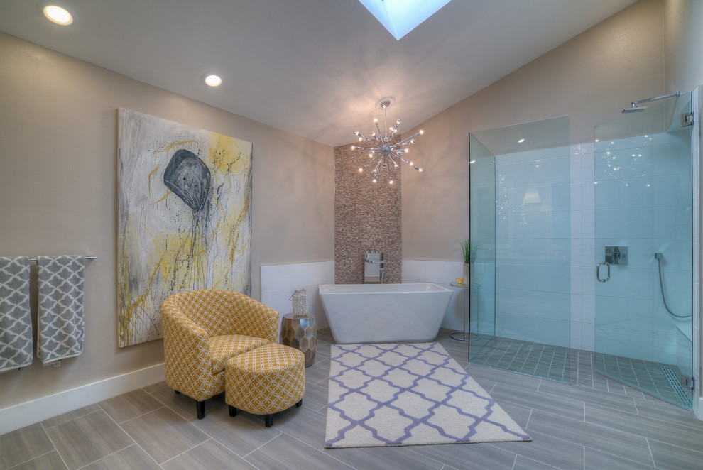 Photo of a large contemporary master bathroom in Seattle with a freestanding tub, a corner shower, beige tile, stone tile, beige walls and vinyl floors.