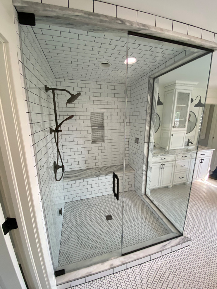 This is an example of a country master bathroom in Cleveland with beaded inset cabinets, white cabinets, a claw-foot tub, a corner shower, black and white tile, subway tile, white walls, mosaic tile floors, an undermount sink, marble benchtops, white floor, a hinged shower door, white benchtops, a shower seat, a double vanity, a freestanding vanity and planked wall panelling.
