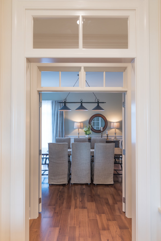 Example of a large transitional home design design