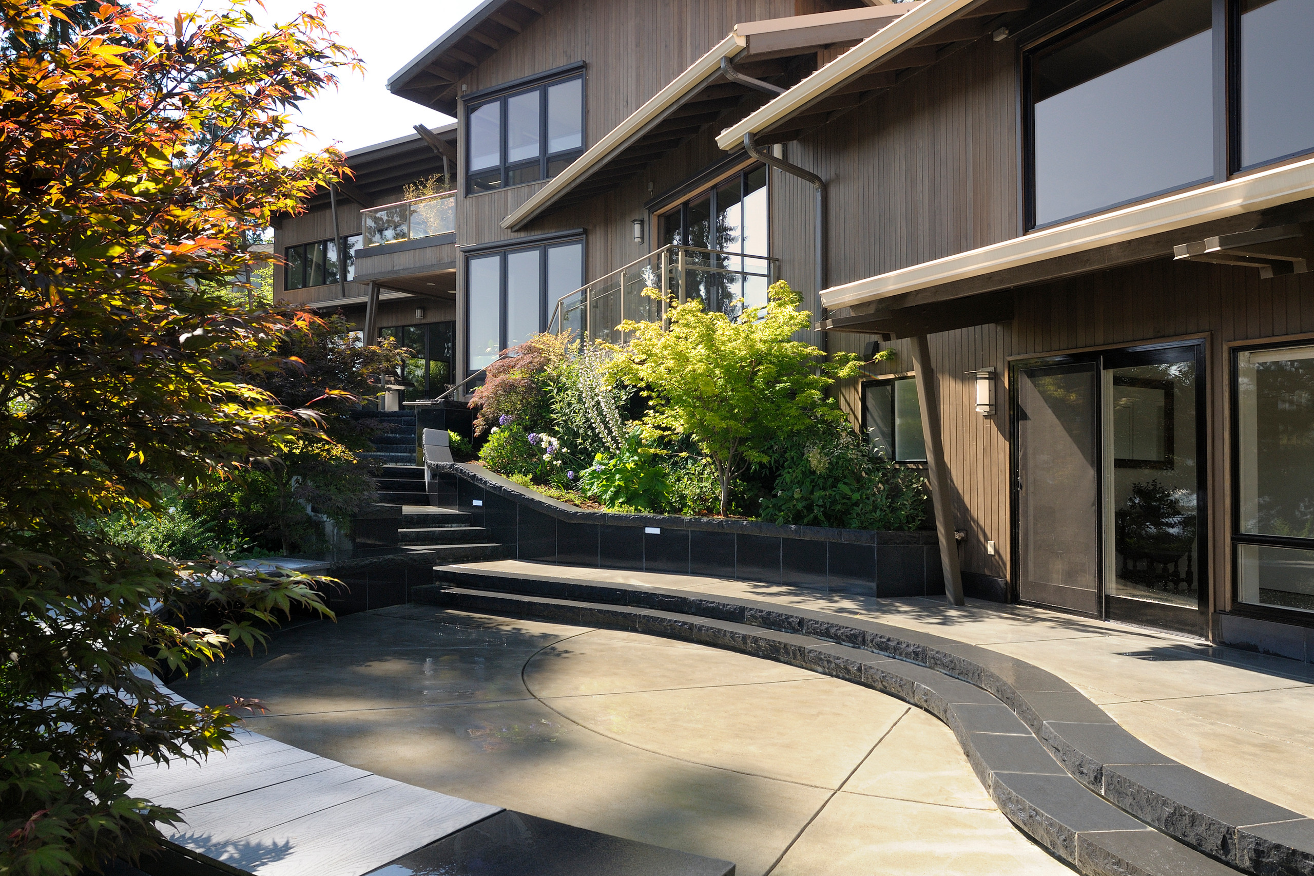 View from rear patio up to pool house