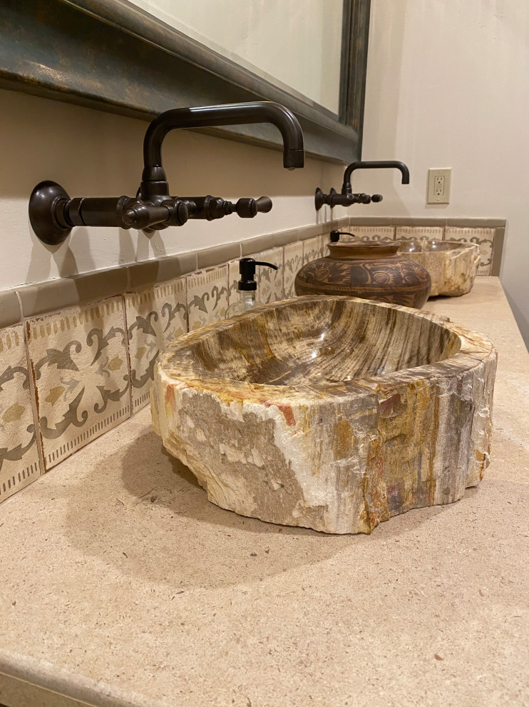 Medium sized rustic bathroom in Phoenix with raised-panel cabinets, brown cabinets, a built-in shower, a two-piece toilet, beige tiles, limestone tiles, white walls, concrete flooring, a vessel sink, limestone worktops, grey floors, an open shower, beige worktops, a wall niche, double sinks and a built in vanity unit.