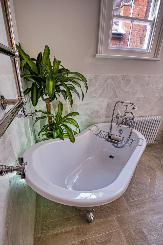 Inspiration for a large classic grey and cream bathroom in Surrey with shaker cabinets, beige cabinets, a claw-foot bath, a walk-in shower, a one-piece toilet, grey tiles, marble tiles, grey walls, porcelain flooring, a built-in sink, marble worktops, beige floors, an open shower, white worktops, a dado rail, a single sink and a freestanding vanity unit.