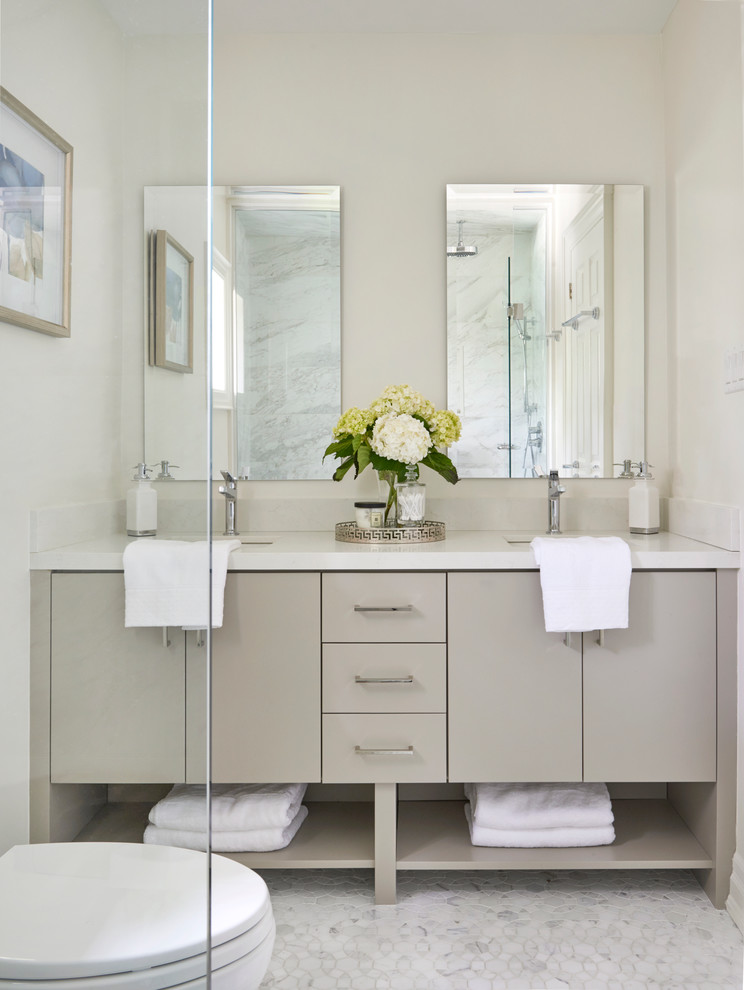 Doorless shower - small transitional master multicolored tile and mosaic tile marble floor doorless shower idea in Toronto with flat-panel cabinets, gray cabinets, a two-piece toilet, gray walls, an undermount sink and quartz countertops