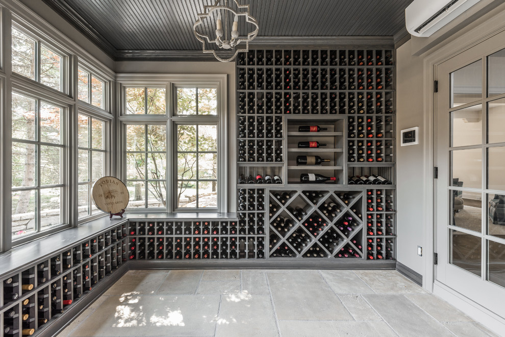 Design ideas for a traditional wine cellar in Indianapolis with storage racks.