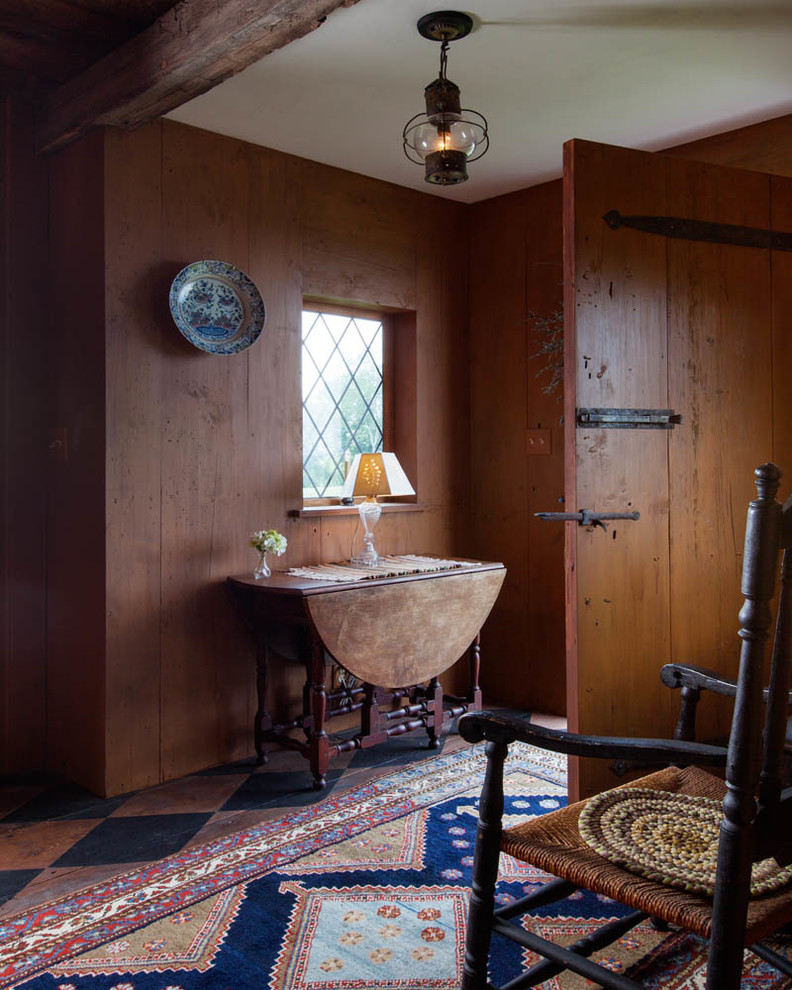 Inspiration for a country foyer in Boston with a single front door and a dark wood front door.