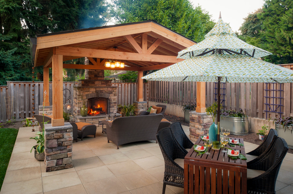 Traditional backyard patio in Portland with a gazebo/cabana and a fire feature.