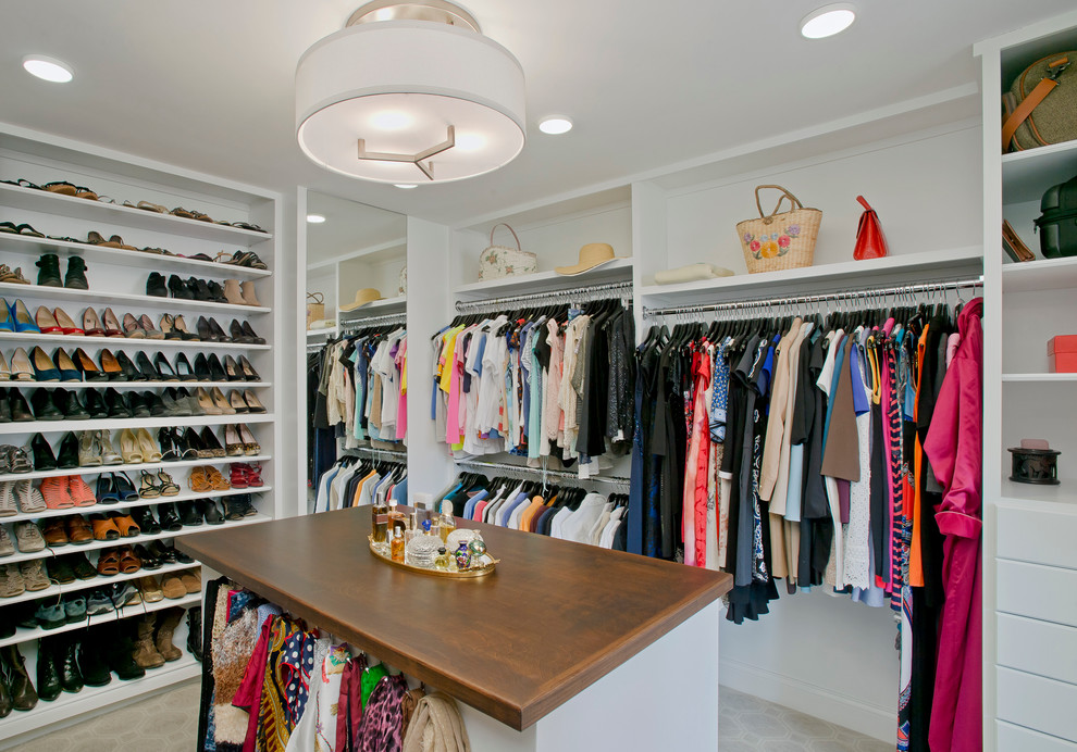 Inspiration for a large traditional women's walk-in wardrobe in Baltimore with white cabinets, carpet and open cabinets.