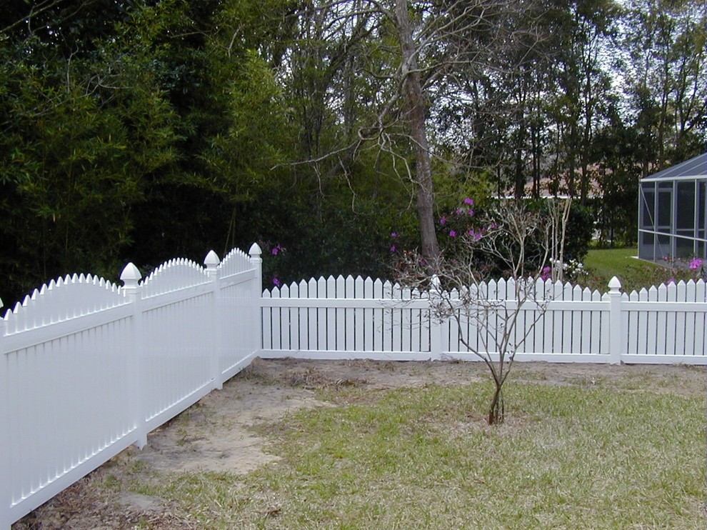 This is an example of a mid-sized mediterranean full sun backyard formal garden in Tampa.