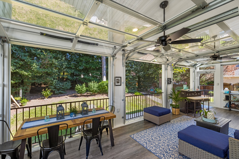 Design ideas for a large tropical sunroom in Richmond with vinyl floors, a standard ceiling and beige floor.