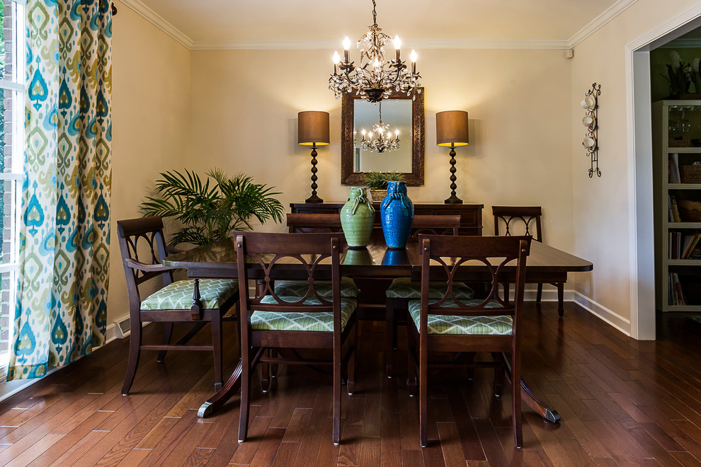 Photo of a mid-sized traditional separate dining room in Other with beige walls, medium hardwood floors and brown floor.