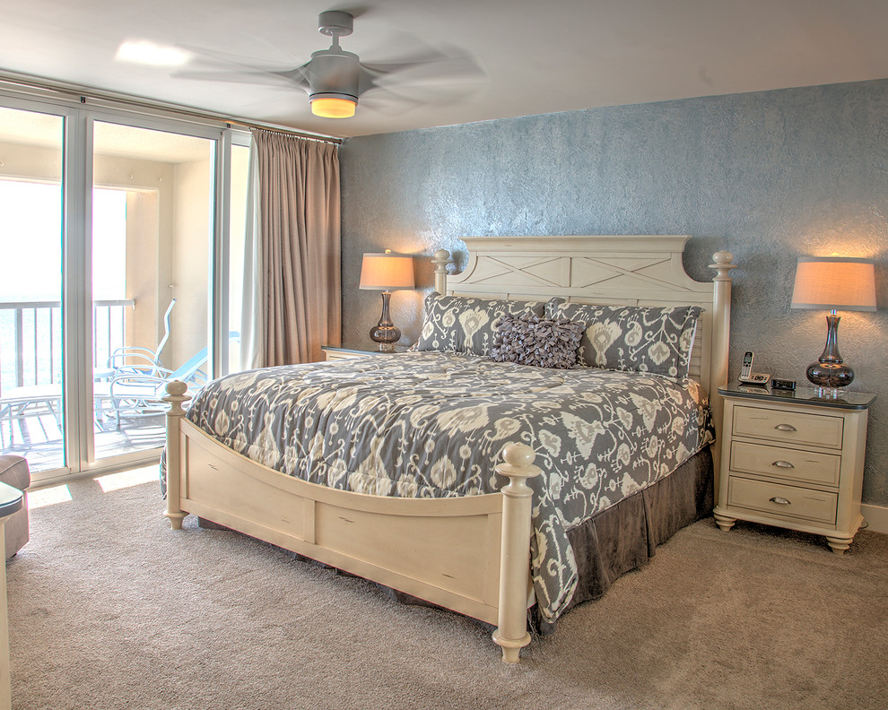 This is an example of a small transitional master bedroom in Miami with blue walls and carpet.