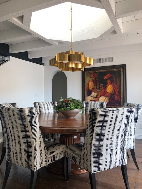 Inspiration for a mid-sized transitional medium tone wood floor and brown floor dining room remodel in Phoenix