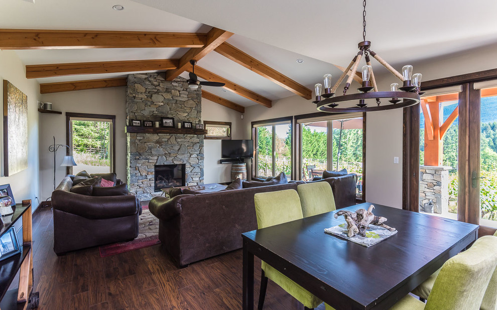 Transitional dark wood floor great room photo in Toronto with beige walls, a standard fireplace and a stone fireplace