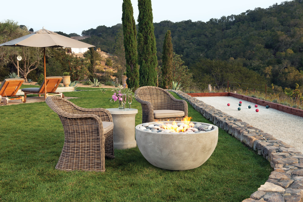 Inspiration for a transitional backyard outdoor sport court in San Diego with a fire feature.
