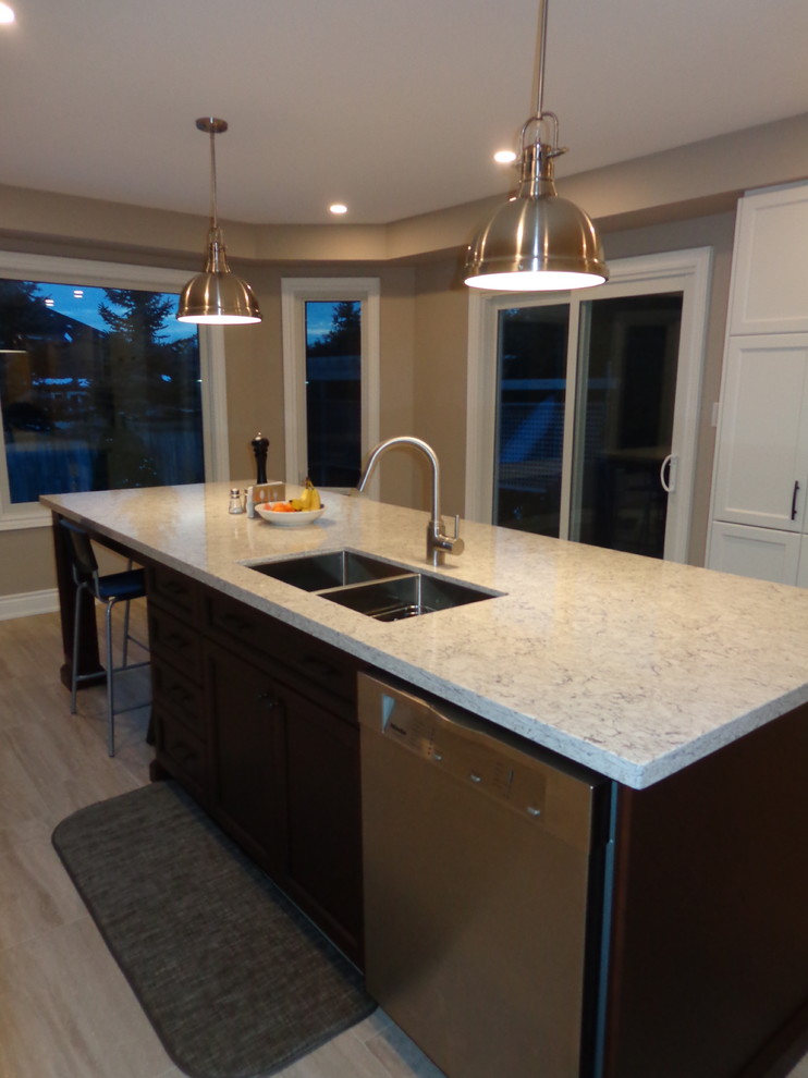 Example of a transitional kitchen design in Toronto