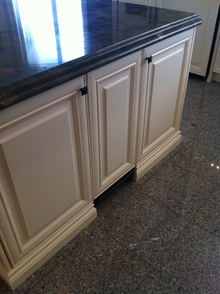 Open concept kitchen - large transitional u-shaped terrazzo floor and black floor open concept kitchen idea in Miami with a single-bowl sink, raised-panel cabinets, white cabinets, granite countertops, multicolored backsplash, stone tile backsplash, stainless steel appliances and an island