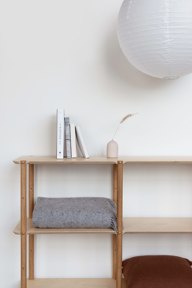This is an example of a small scandinavian open plan dining in Melbourne with white walls, no fireplace and white floor.