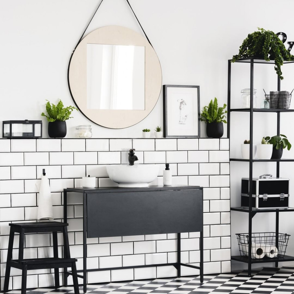 Modern master bathroom in Marseille with black cabinets, white tile, matchstick tile, white walls, ceramic floors, a vessel sink, solid surface benchtops, black benchtops, a single vanity and a freestanding vanity.