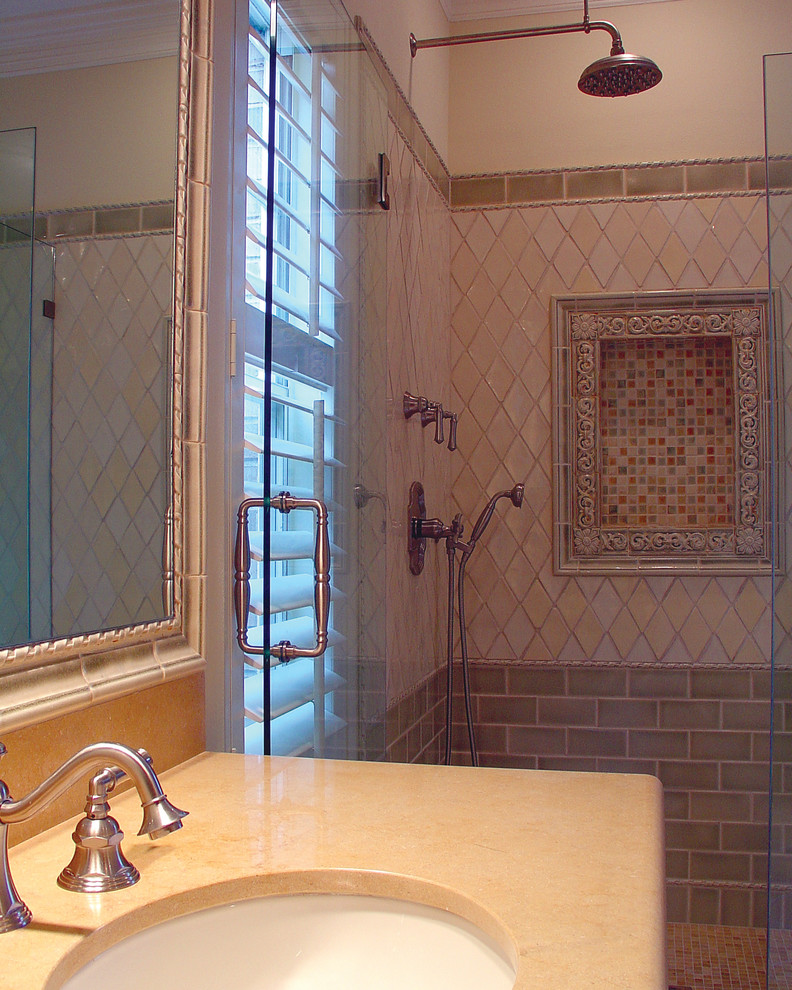 Photo of a mid-sized traditional master bathroom in Houston with raised-panel cabinets, marble benchtops, a drop-in tub, an open shower, green tile, ceramic tile, beige walls and limestone floors.