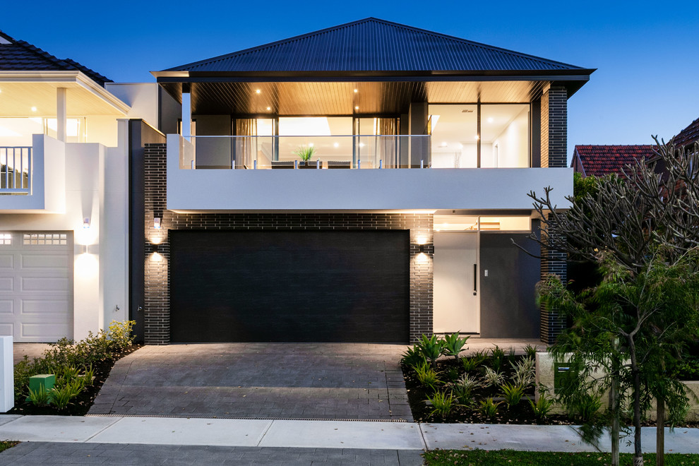 Contemporary two-storey brick black house exterior in Perth with a hip roof and a metal roof.