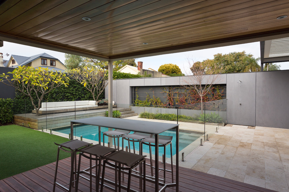 Pool - mid-sized backyard concrete paver and rectangular pool idea in Perth