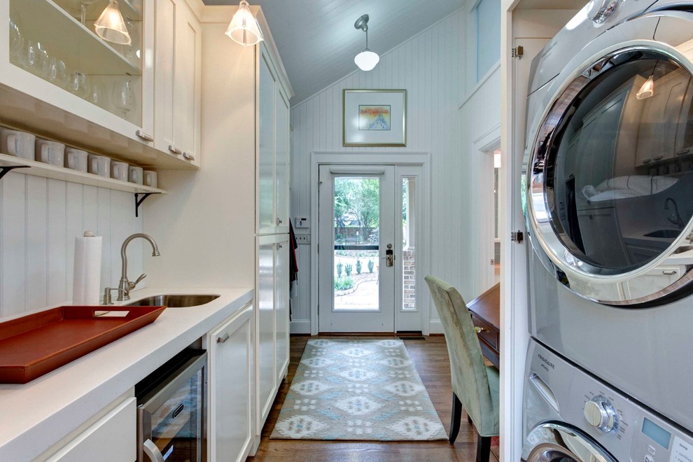 This is an example of a transitional laundry room in Raleigh.